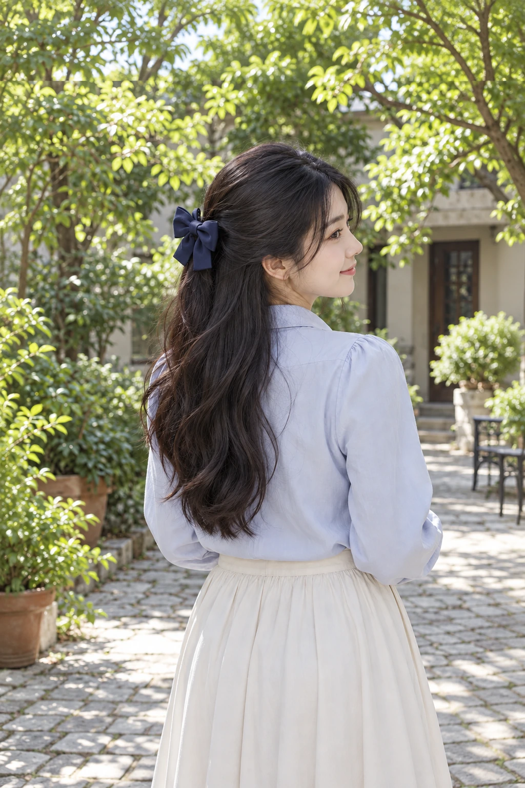 Loose dark waves held back on one side with a fabric bow clip.